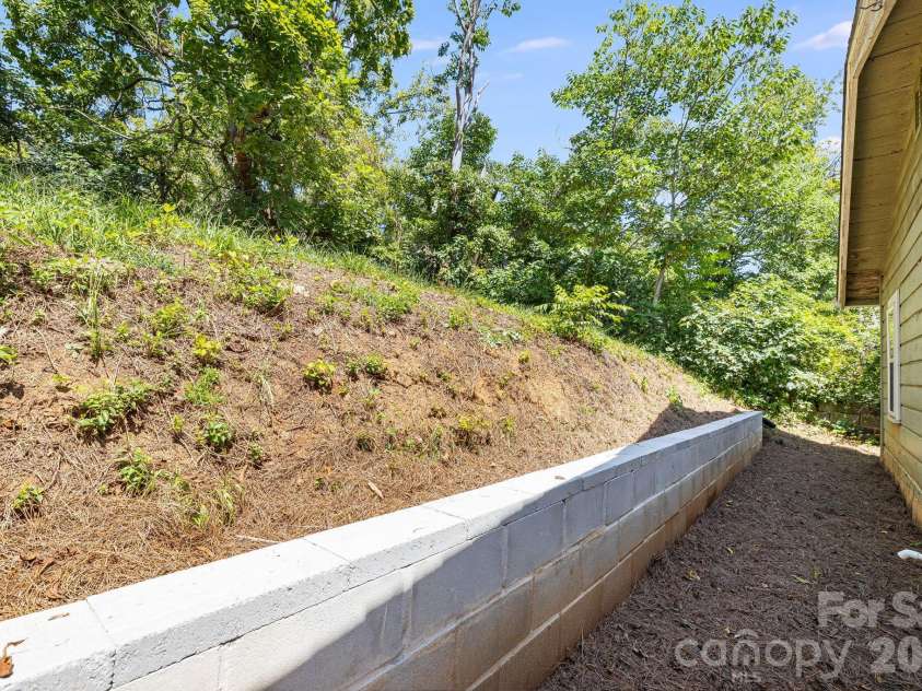1055 Riverside Drive, Asheville, NC 28804.  MLS# CAR4397717, YatesRealty ID 47092. Retaining Wall