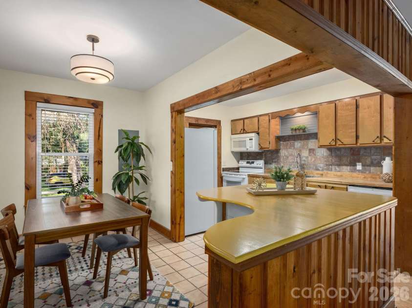 304 Old Haw Creek Road, Asheville, NC 28805.  MLS# CAR4406556, YatesRealty ID 47093. Connected Kitchen & Dining Spaces