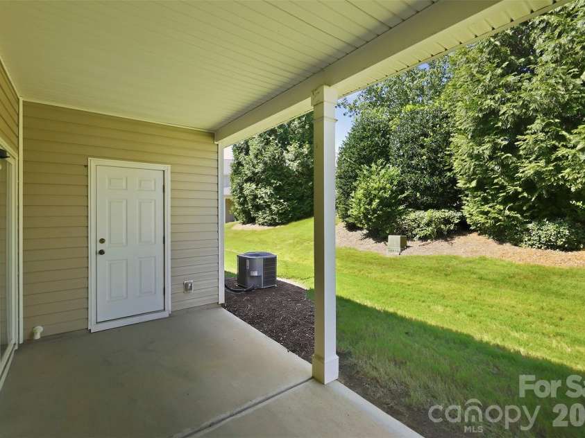 217 River Clay Road, Fort Mill, SC 29708.  MLS# CAR4415592, YatesRealty ID 47096. Back patio and tree view