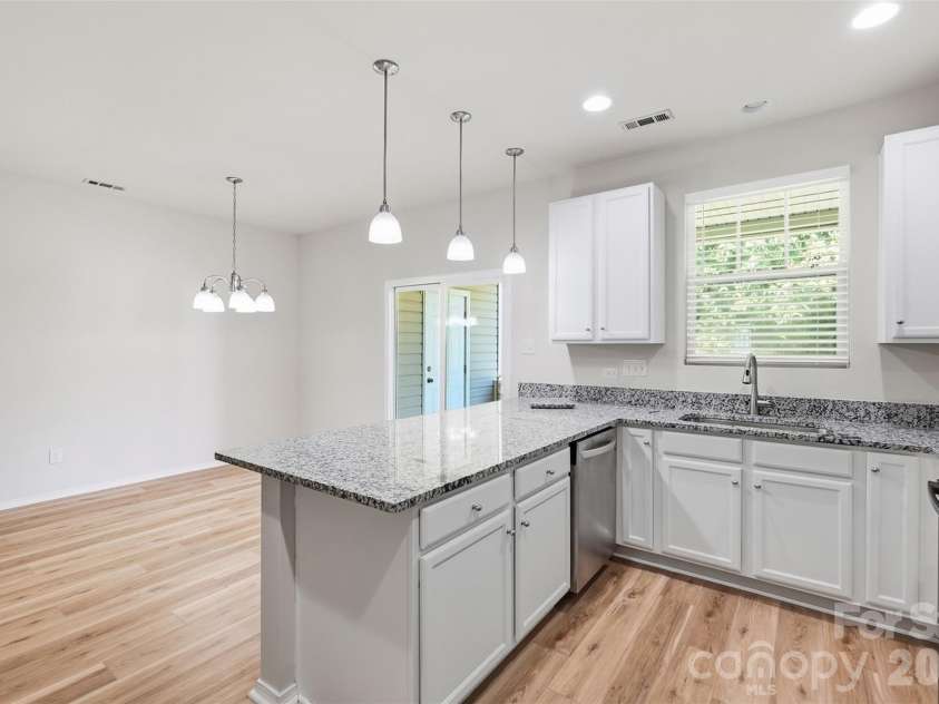 217 River Clay Road, Fort Mill, SC 29708.  MLS# CAR4415592, YatesRealty ID 47096. Kitchen counter and dining area