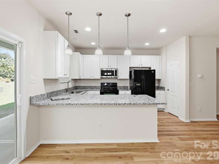 217 River Clay Road, Fort Mill, SC 29708.  MLS# CAR4415592, YatesRealty ID 47096. Kitchen (note: counters and pendant lighting)