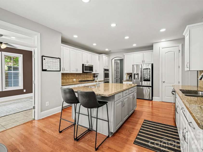 11242 Wheat Ridge Road, Charlotte, NC 28277.  MLS# CAR4416116, YatesRealty ID 47105. Kitchen next to Sunroom
