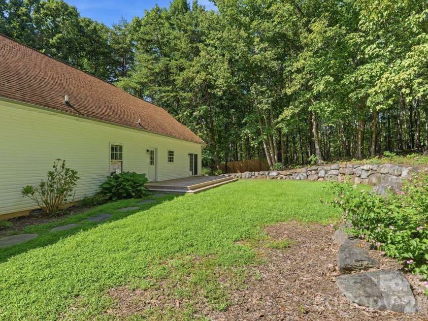 5480 Liberty Hill Road, York, SC 29745.  MLS# CAR4416036, YatesRealty ID 47114. Rear yard with professionally installed rock wall