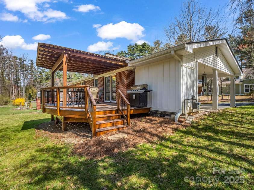 19 Robert E Lee Drive, Flat Rock, NC 28731.  MLS# CAR4235643, YatesRealty ID 4712. Covered back deck and side of carport