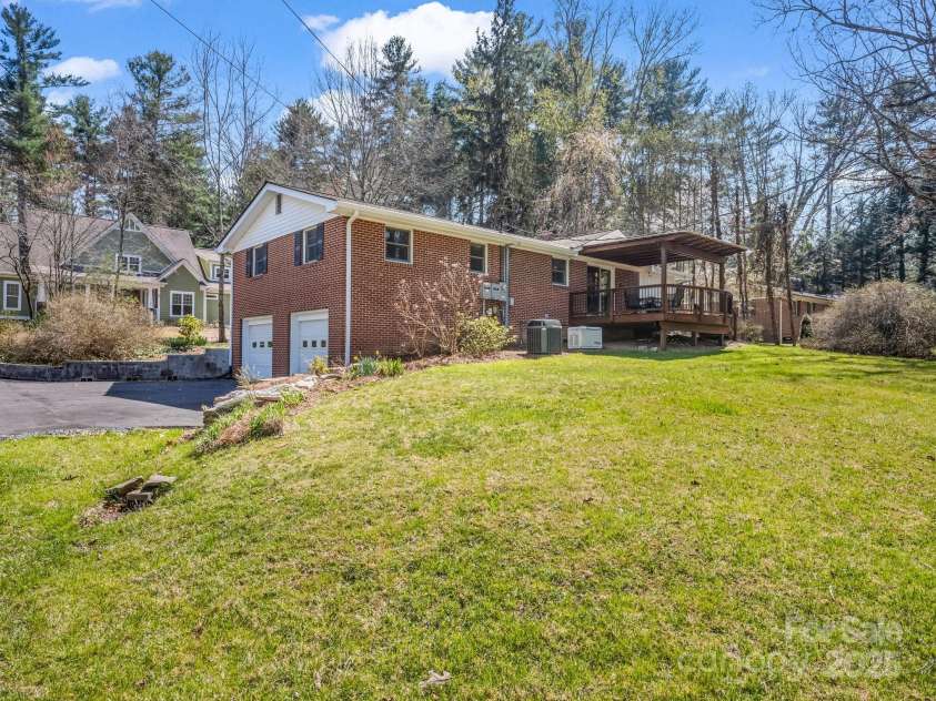 19 Robert E Lee Drive, Flat Rock, NC 28731.  MLS# CAR4235643, YatesRealty ID 4712. Covered back deck for relaxing and outdoor meals