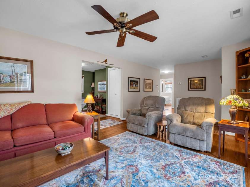 19 Robert E Lee Drive, Flat Rock, NC 28731.  MLS# CAR4235643, YatesRealty ID 4712. Living area, looking toward kitchen and hallway to bedrooms