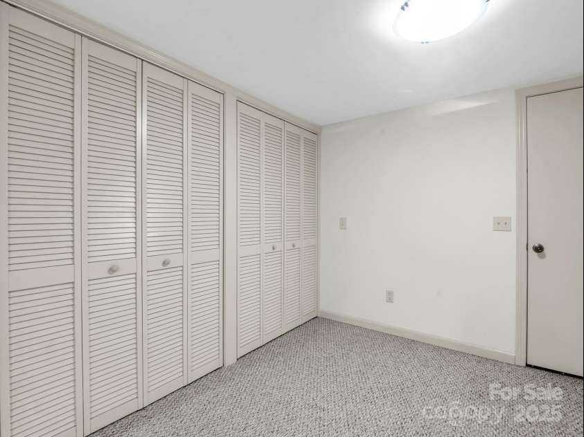 19 Robert E Lee Drive, Flat Rock, NC 28731.  MLS# CAR4235643, YatesRealty ID 4712. Lower level closet area