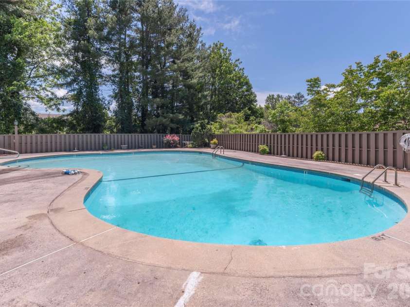 121 Deerlake Drive, Asheville, NC 28803.  MLS# CAR4417222, YatesRealty ID 47122. Community inground pool