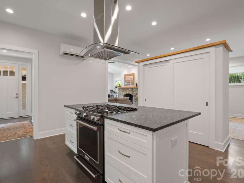 497 Kimberly Avenue, Asheville, NC 28804.  MLS# CAR4418041, YatesRealty ID 47149. Custom built island pantry divides the dining room from the kitchen while still feeling very open