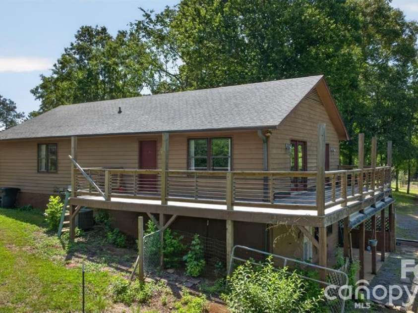 00 Misery Ridge Trail, Mill Spring, NC 28756.  MLS# CAR4385906, YatesRealty ID 47162. Rear view showing wraparound deck.