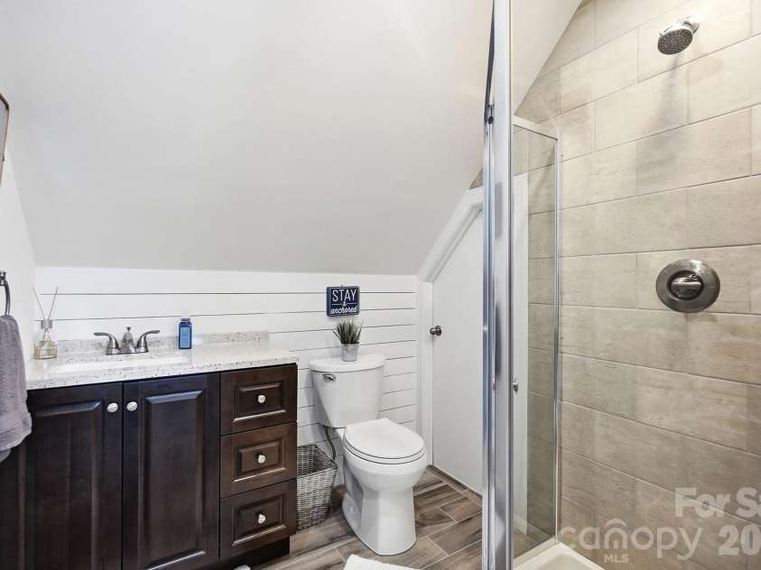 7310 Swansea Lane, Cornelius, NC 28031.  MLS# CAR4415897, YatesRealty ID 47163. Ensuite bath with additional cedar-lined closet and attic storage.