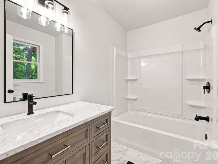 151 Ridgewood Acres Drive, Hendersonville, NC 28792.  MLS# CAR4418419, YatesRealty ID 47183. Completely renovated Primary Bath