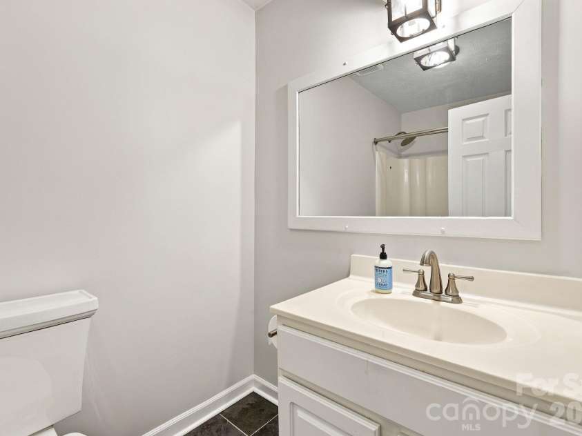 151 Ridgewood Acres Drive, Hendersonville, NC 28792.  MLS# CAR4418419, YatesRealty ID 47183. Hall bathroom