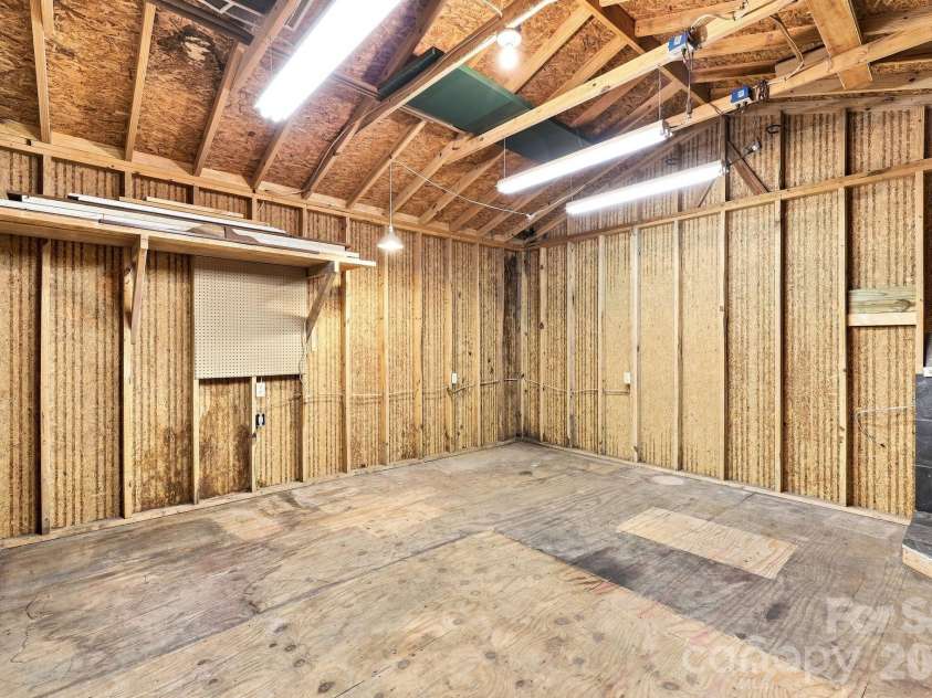 151 Ridgewood Acres Drive, Hendersonville, NC 28792.  MLS# CAR4418419, YatesRealty ID 47183. Inside workshop from entrance