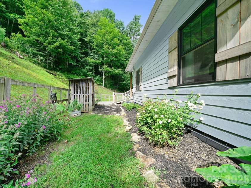 1523 Roaring Fork Road, Burnsville, NC 28714.  MLS# CAR4408382, YatesRealty ID 47187. Side Yard