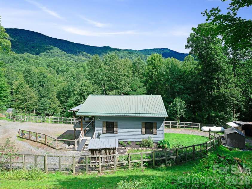 1523 Roaring Fork Road, Burnsville, NC 28714.  MLS# CAR4408382, YatesRealty ID 47187. Side Yard