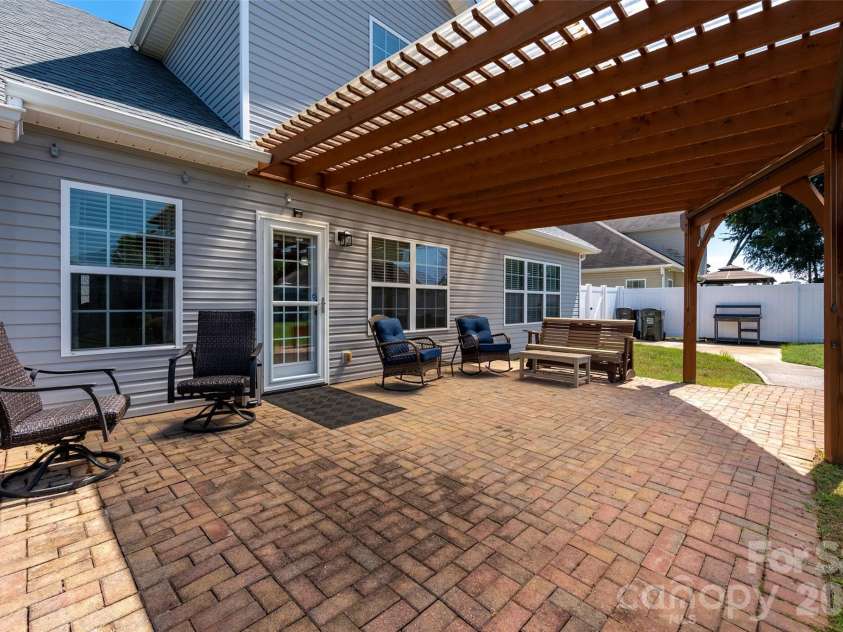 5335 Hackberry Lane, Concord, NC 28027.  MLS# CAR4418402, YatesRealty ID 47188. Covered paver patio