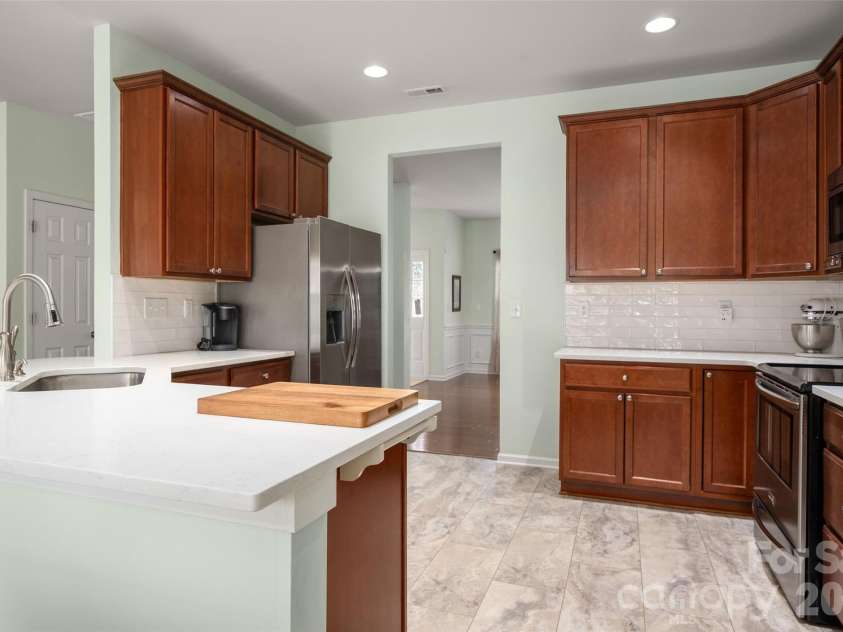 5335 Hackberry Lane, Concord, NC 28027.  MLS# CAR4418402, YatesRealty ID 47188. Kitchen features quartz countertops