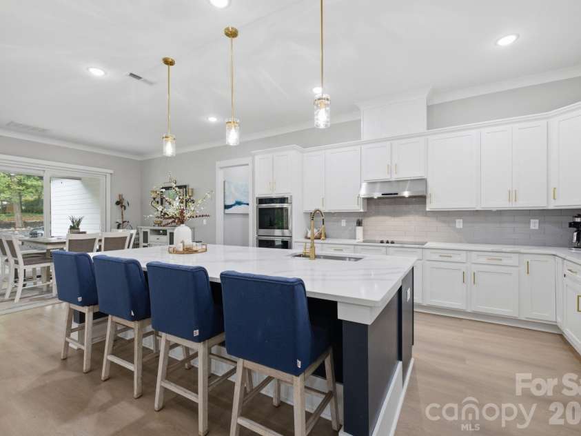 6021 Monticello Drive, Concord, NC 28027.  MLS# CAR4418703, YatesRealty ID 47198. Beautifully appointed kitchen with oversized center island