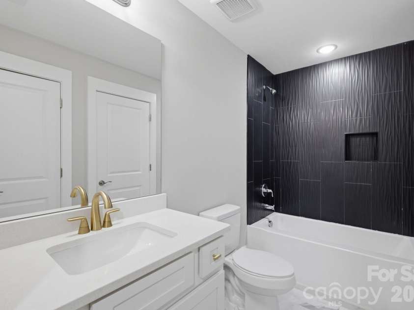6021 Monticello Drive, Concord, NC 28027.  MLS# CAR4418703, YatesRealty ID 47198. Full bath serving the second living quarters