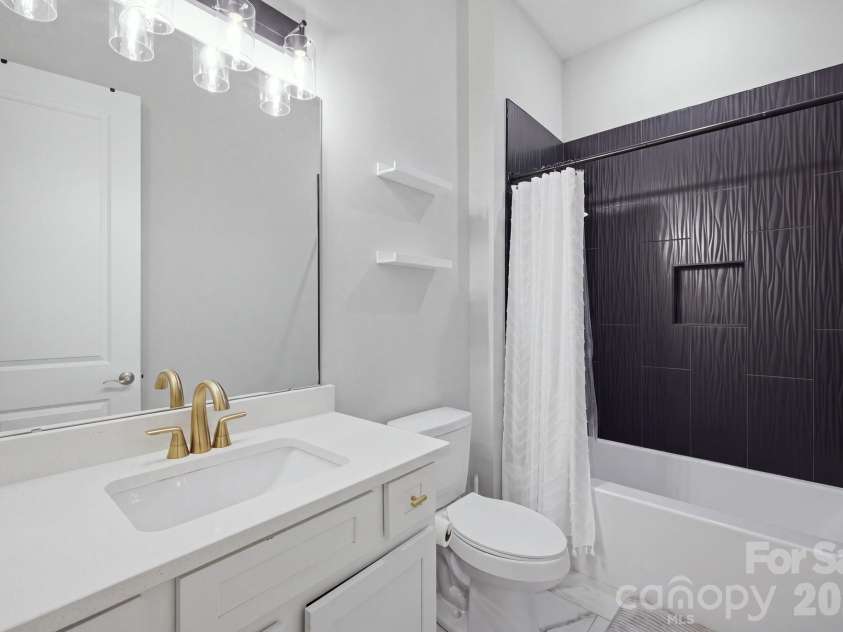 6021 Monticello Drive, Concord, NC 28027.  MLS# CAR4418703, YatesRealty ID 47198. Full guest bath with modern finishes