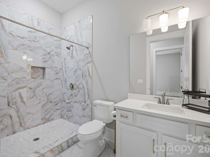 6021 Monticello Drive, Concord, NC 28027.  MLS# CAR4418703, YatesRealty ID 47198. Full lower level bath