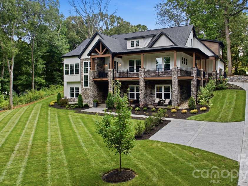 6021 Monticello Drive, Concord, NC 28027.  MLS# CAR4418703, YatesRealty ID 47198. Impressive front exterior with expansive lawn.