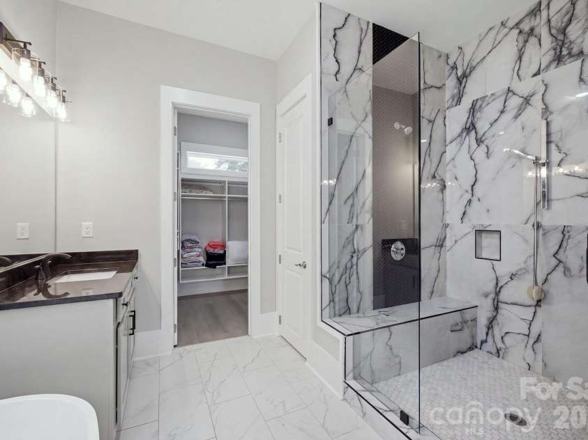 6021 Monticello Drive, Concord, NC 28027.  MLS# CAR4418703, YatesRealty ID 47198. Primary bath featuring soaking tub and oversized tiled shower