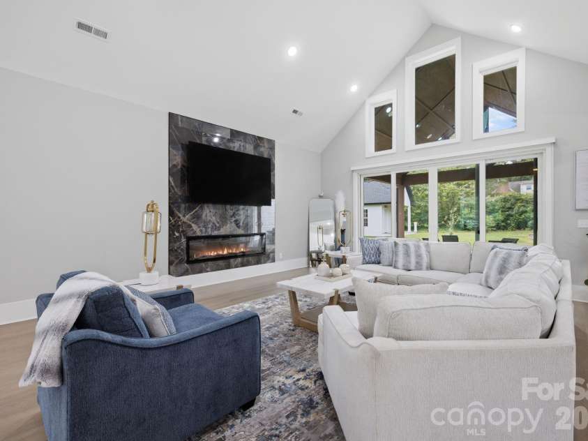 6021 Monticello Drive, Concord, NC 28027.  MLS# CAR4418703, YatesRealty ID 47198. Spacious great room with soaring ceilings and expansive windows