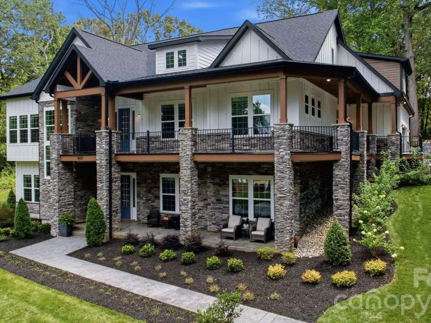 6021 Monticello Drive, Concord, NC 28027.  MLS# CAR4418703, YatesRealty ID 47198. Welcoming front elevation with stone and architectural detailing