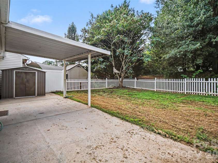 1356 Copper Creek Lane, Fort Mill, SC 29715.  MLS# CAR4418757, YatesRealty ID 47199. Back patio with covered area