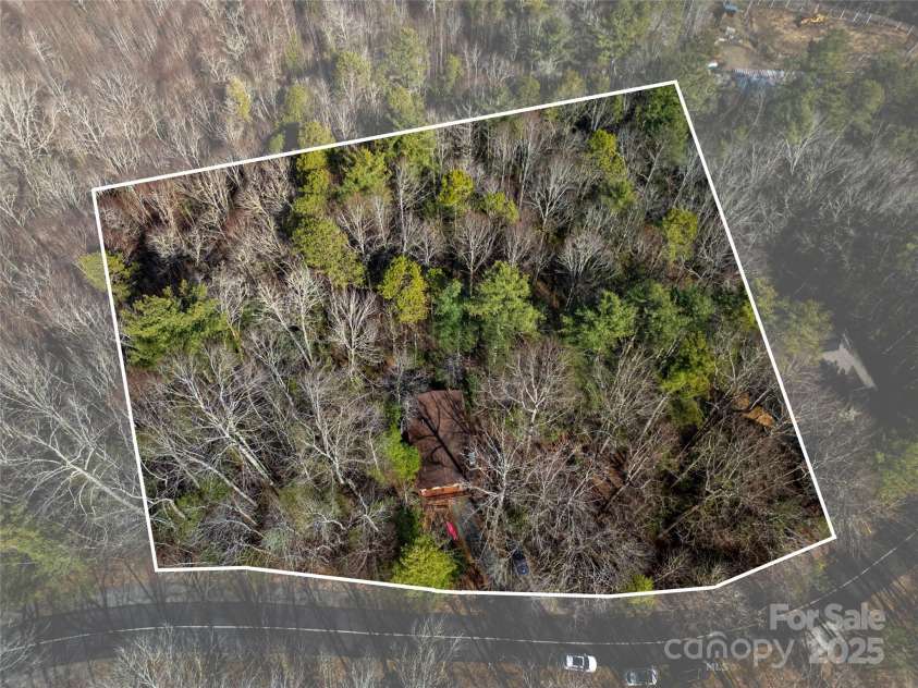 177 Walelu Court, Brevard, NC 28712.  MLS# CAR4333562, YatesRealty ID 4722. Current owner purchased lots on each side of the home to maximize privacy for a total of 2.23 acres combined.