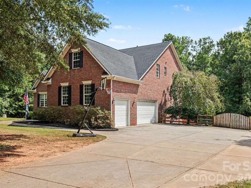 3647 Venetian Way, York, SC 29745.  MLS# CAR4417986, YatesRealty ID 47230. Three-car garage/side elevation