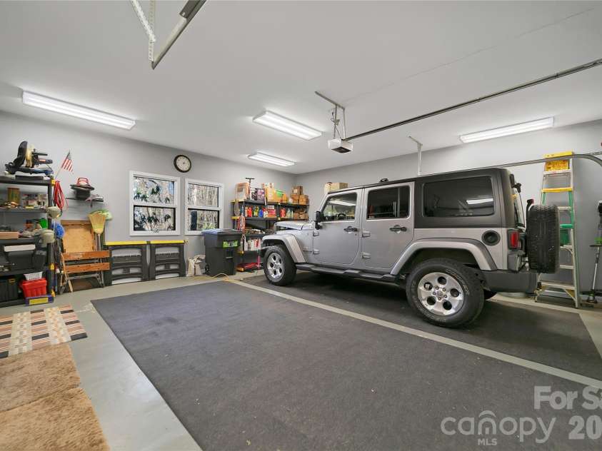 59 Agaliha Lane, Brevard, NC 28712.  MLS# CAR4338161, YatesRealty ID 4724. 2 car garage with Epoxy floors.