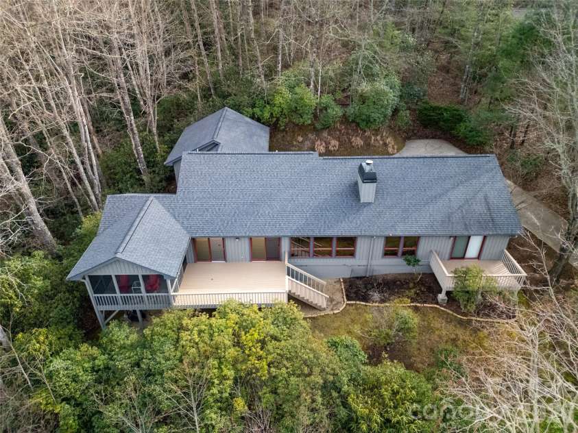 59 Agaliha Lane, Brevard, NC 28712.  MLS# CAR4338161, YatesRealty ID 4724. A tree house feeling with the privacy given to you with the bushes and trees around the home.