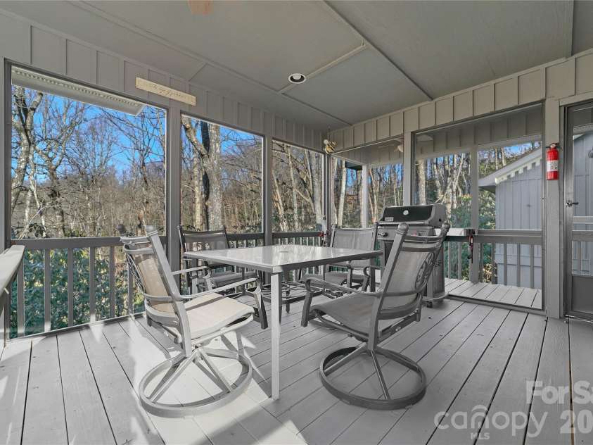 59 Agaliha Lane, Brevard, NC 28712.  MLS# CAR4338161, YatesRealty ID 4724. Additional entertainment space for dining in the wonderful screened in porch. Easily accessed from the Kitchen.
