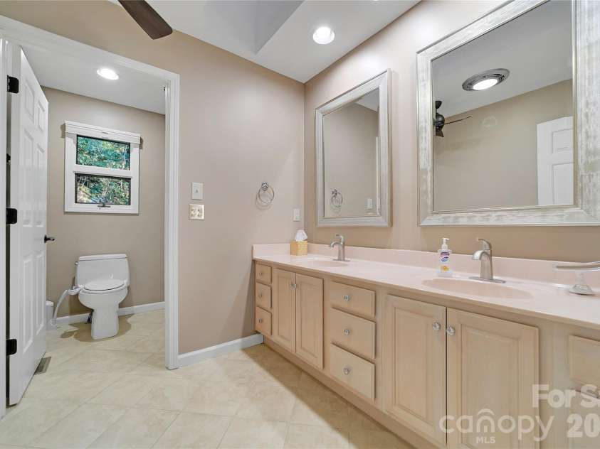59 Agaliha Lane, Brevard, NC 28712.  MLS# CAR4338161, YatesRealty ID 4724. Double Sinks in the Primary Bathroom
