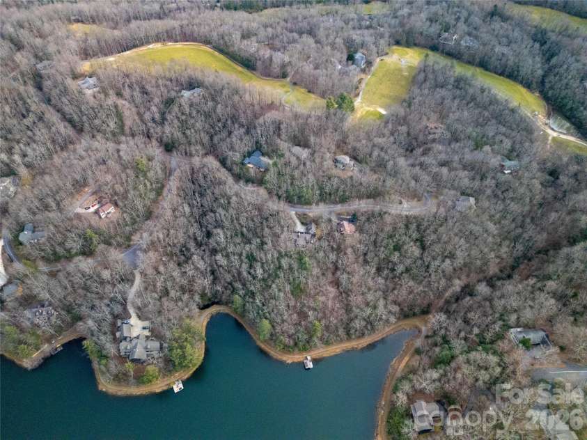 59 Agaliha Lane, Brevard, NC 28712.  MLS# CAR4338161, YatesRealty ID 4724. Enjoy winter lake views from the driveway side of the property.