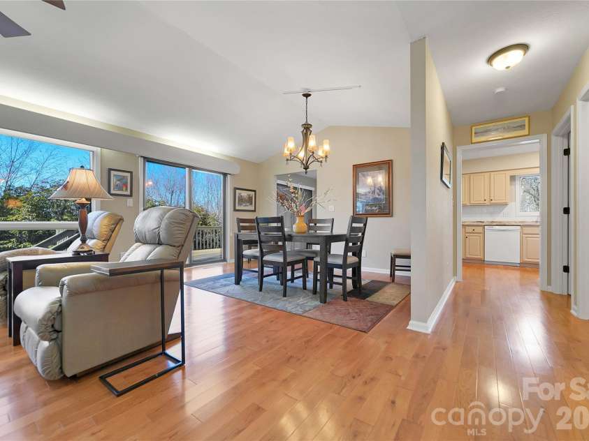 59 Agaliha Lane, Brevard, NC 28712.  MLS# CAR4338161, YatesRealty ID 4724. Great Room access to the kitchen either through the hall or the dining area.