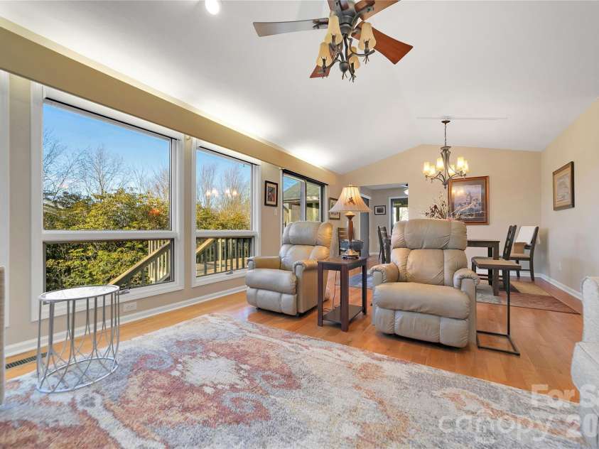 59 Agaliha Lane, Brevard, NC 28712.  MLS# CAR4338161, YatesRealty ID 4724. Great Room flows into the Dining Area