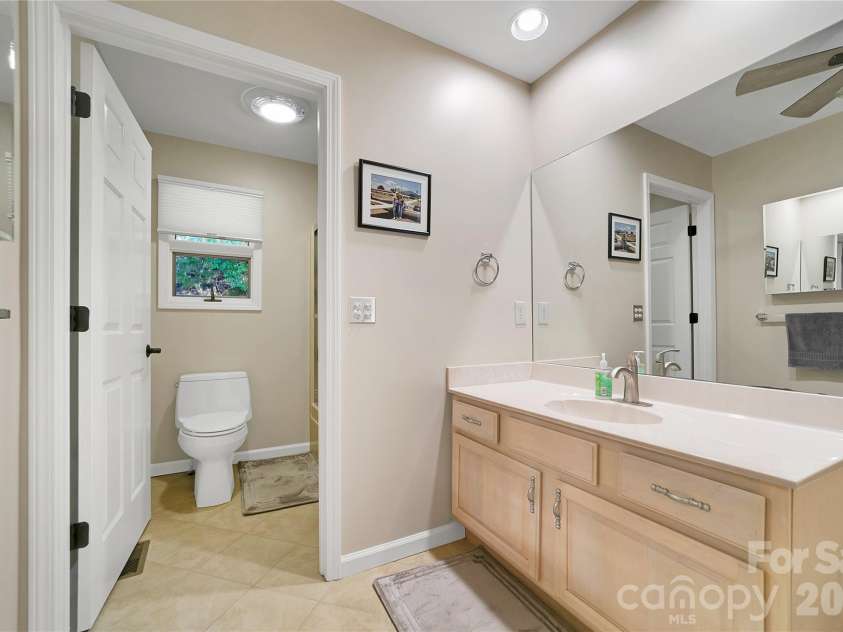 59 Agaliha Lane, Brevard, NC 28712.  MLS# CAR4338161, YatesRealty ID 4724. Hall Guest Full Bath with entrances from the hall and the 1st Guest Bedroom