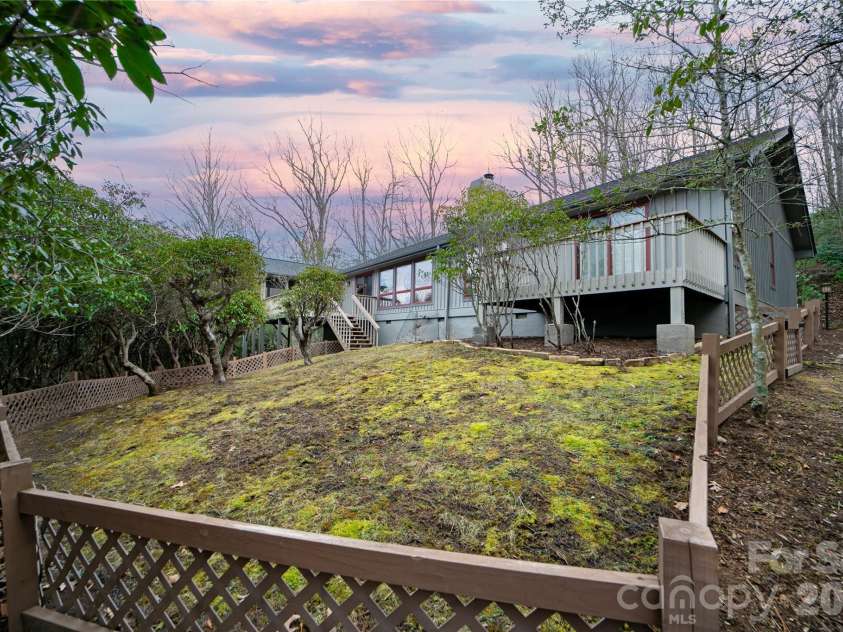 59 Agaliha Lane, Brevard, NC 28712.  MLS# CAR4338161, YatesRealty ID 4724. Plenty of backyard space for your four-legged friends.