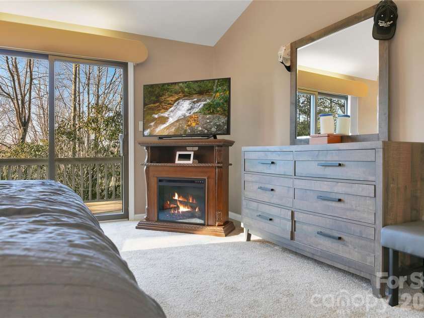 59 Agaliha Lane, Brevard, NC 28712.  MLS# CAR4338161, YatesRealty ID 4724. Primary suite has its own deck area.