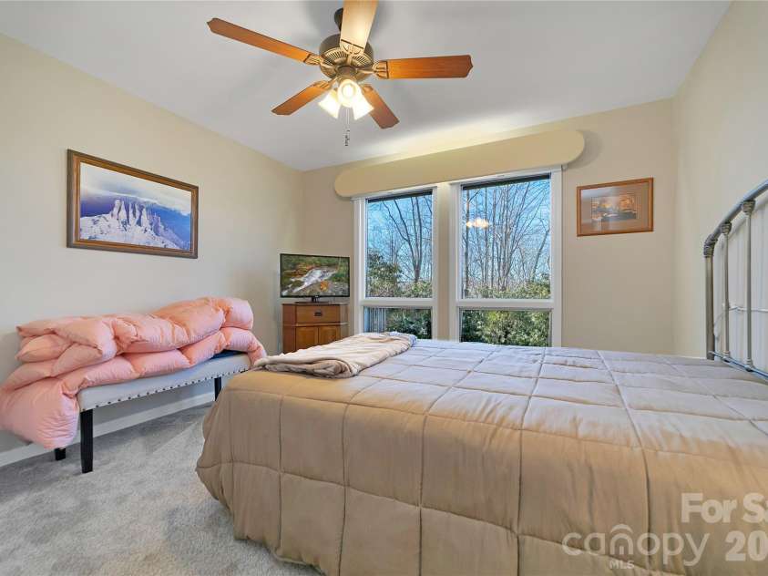 59 Agaliha Lane, Brevard, NC 28712.  MLS# CAR4338161, YatesRealty ID 4724. Primary Suite has the walk-in closet to the left and the primary bathroom to the right.