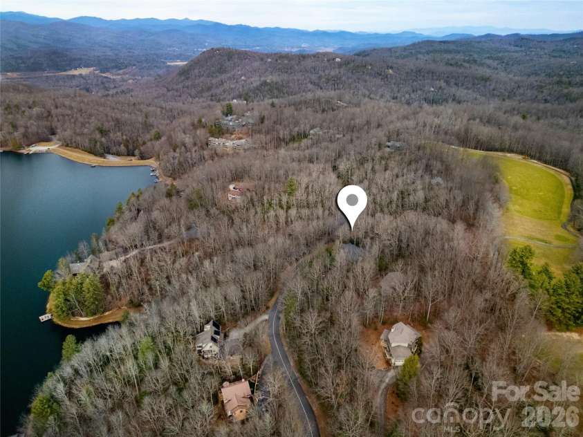 59 Agaliha Lane, Brevard, NC 28712.  MLS# CAR4338161, YatesRealty ID 4724. Property sits amidst the lake, mountains and golf course. 