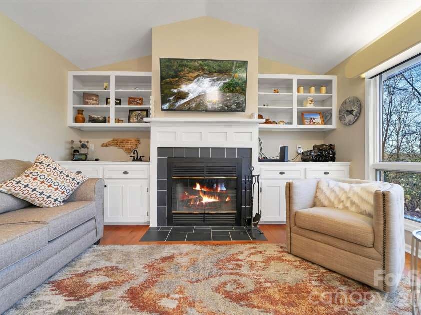 59 Agaliha Lane, Brevard, NC 28712.  MLS# CAR4338161, YatesRealty ID 4724. Recent upgrades to the wood burning fireplace brought it up to current code. 