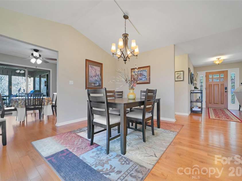 59 Agaliha Lane, Brevard, NC 28712.  MLS# CAR4338161, YatesRealty ID 4724. Site lines to the front foyer and the breakfast area from the Dining Area.