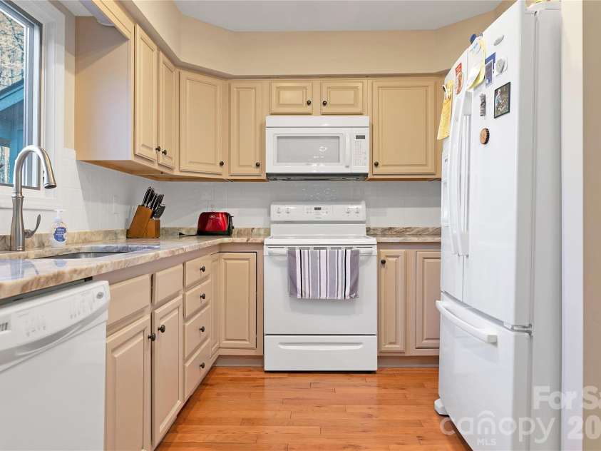 59 Agaliha Lane, Brevard, NC 28712.  MLS# CAR4338161, YatesRealty ID 4724. View of Kitchen from the Breakfast Area.