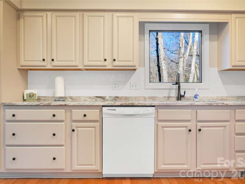 59 Agaliha Lane, Brevard, NC 28712.  MLS# CAR4338161, YatesRealty ID 4724. Views out the window over the kitchen sink.
