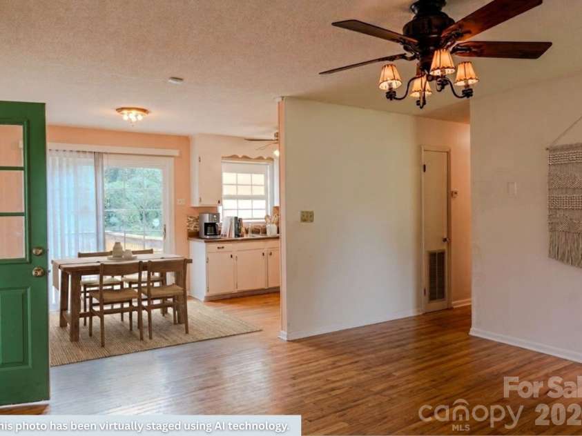 1139 Loblolly Lane, Newton, NC 28658.  MLS# CAR4415938, YatesRealty ID 47241. Virtually Staged Living Room/Dining Area